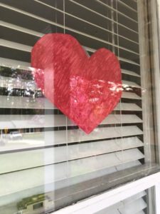A heart shape in the window signals empathy to passersby.